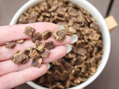 Close Up Hand Ziwi Peak Mackerel & Lamb Recipe Air Dried Dry Cat Food